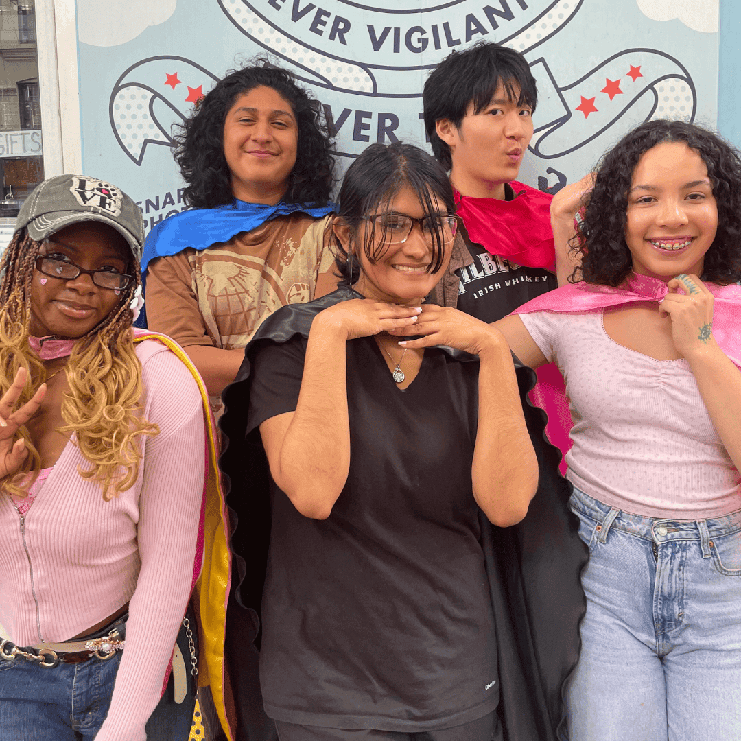 826NYC's five teen writers collective interns pose in front of the Superhero Supply Co.